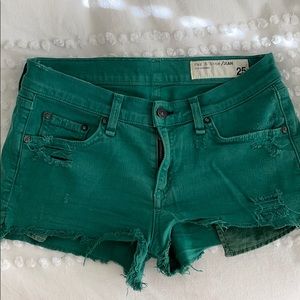 Green stretch denim shorts